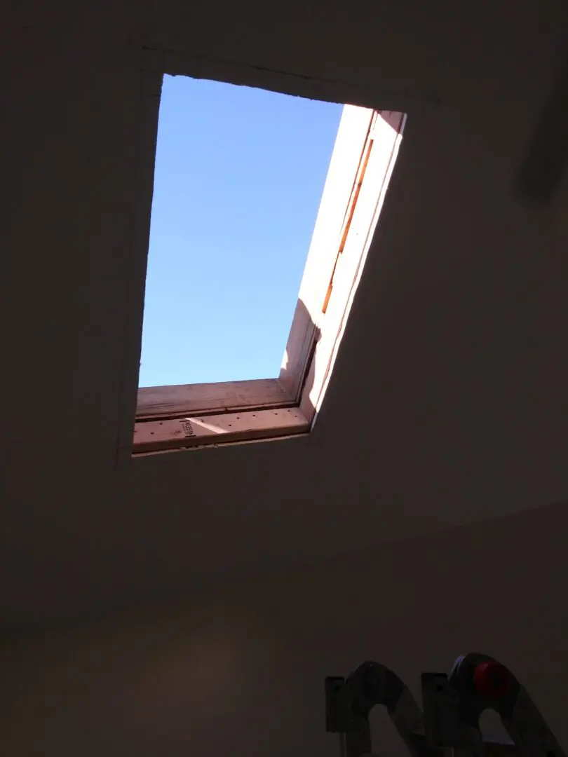 A skylight in the middle of a room.