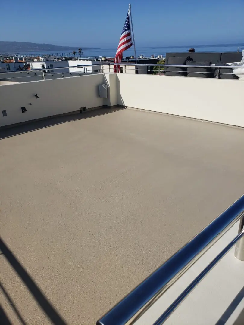 A large deck with a view of the ocean.