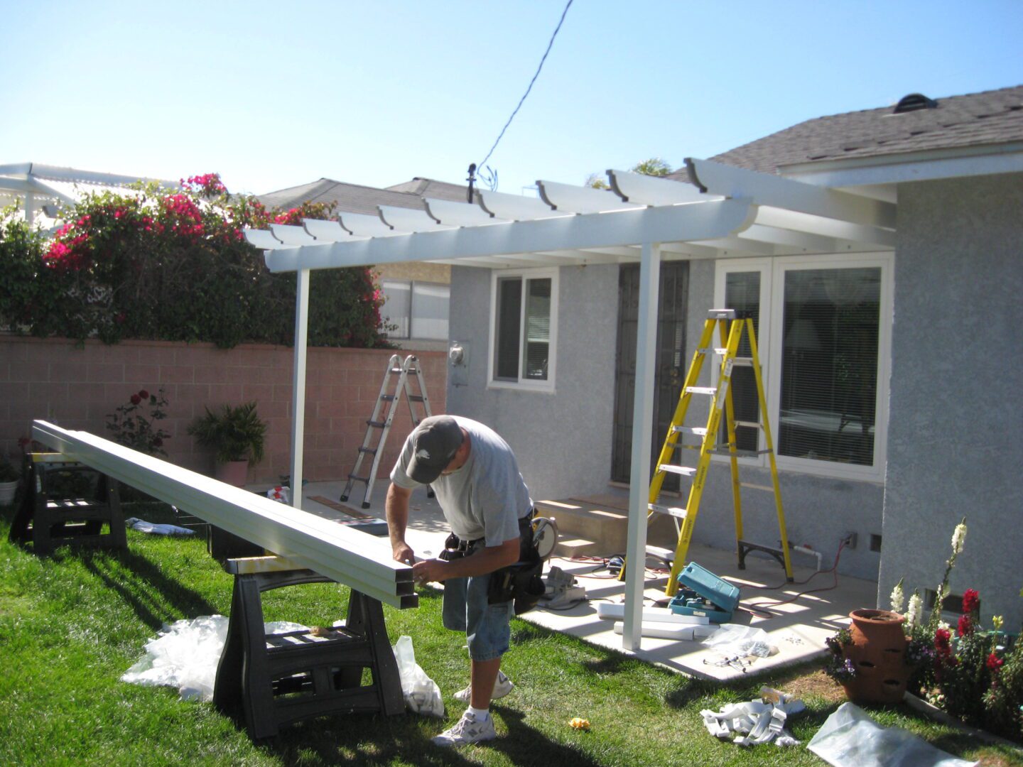 A man working on the roof of his house