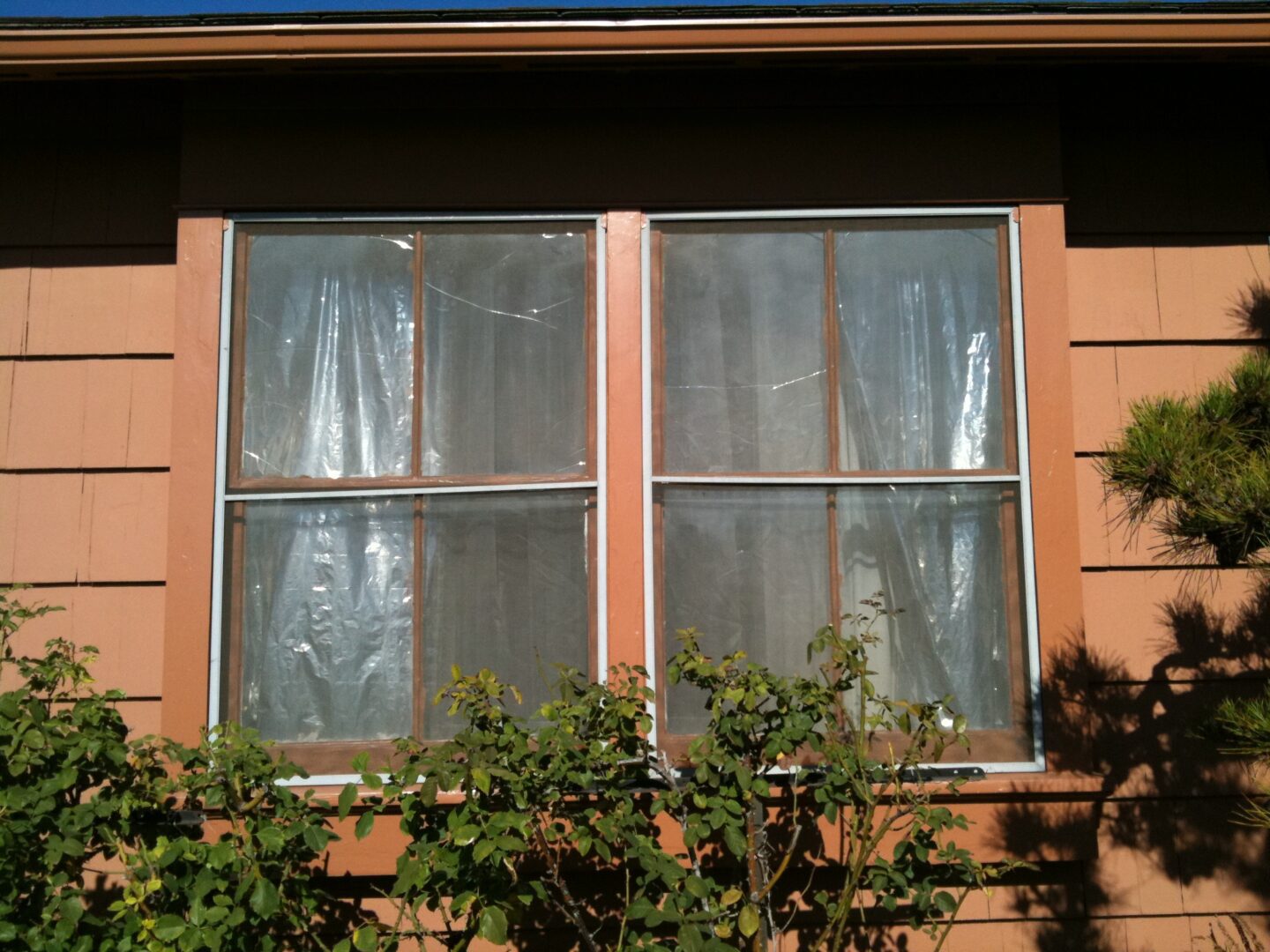 A window with two windows and one is closed.