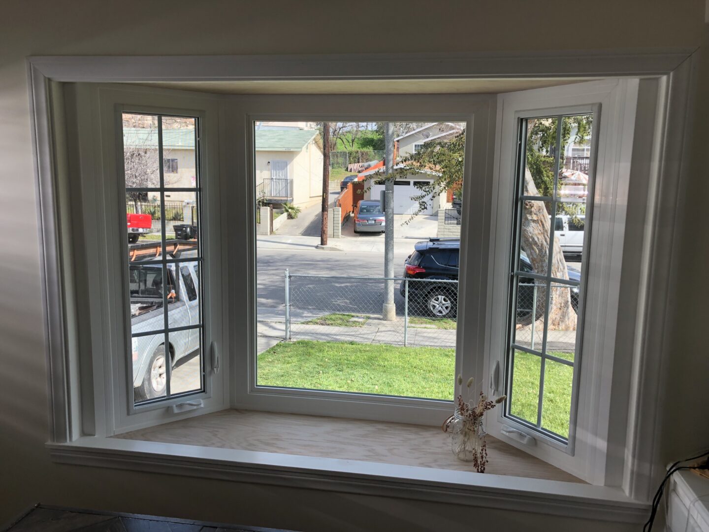 A window with a view of the street.