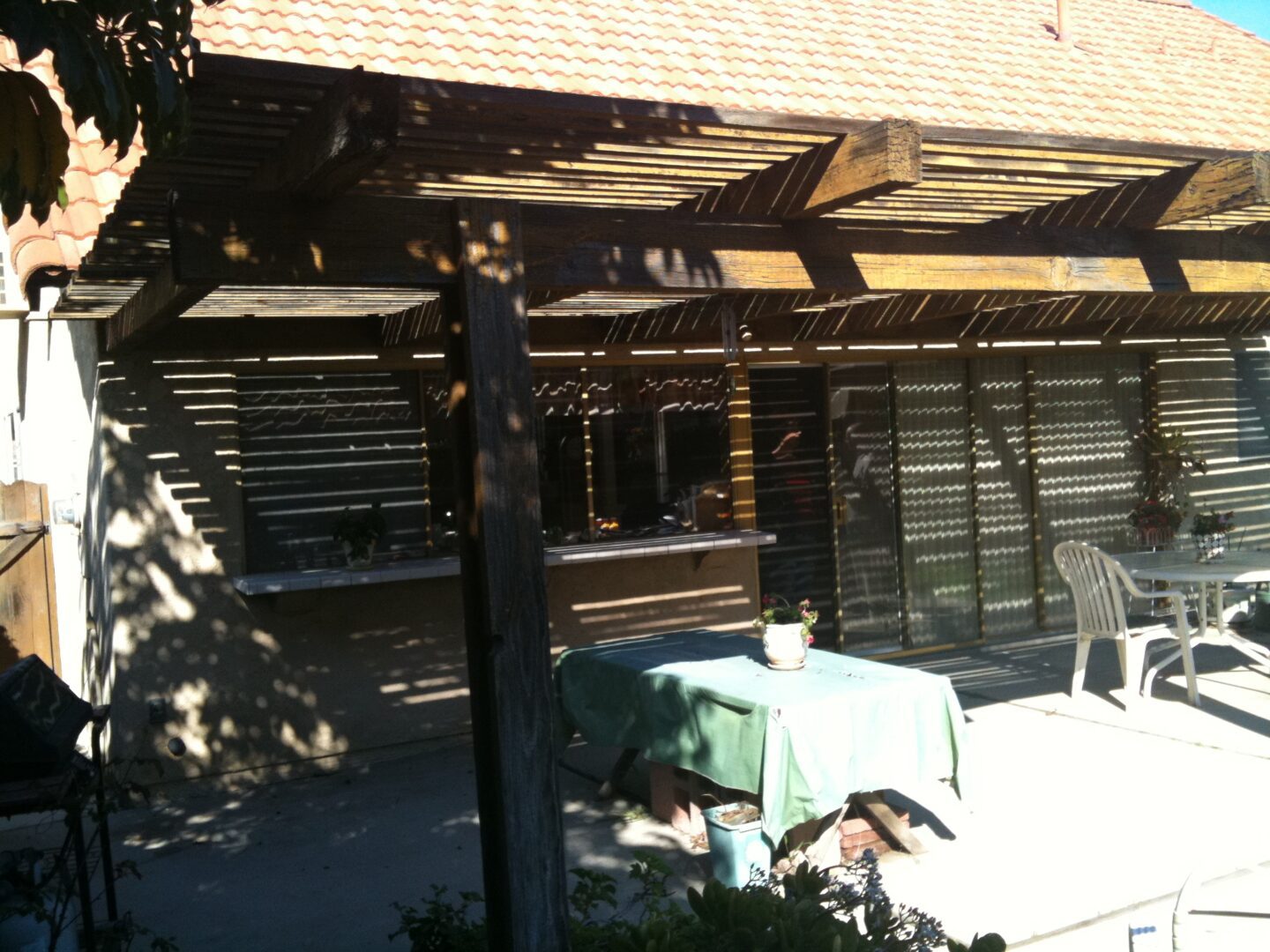 A patio with tables and chairs outside of a building.