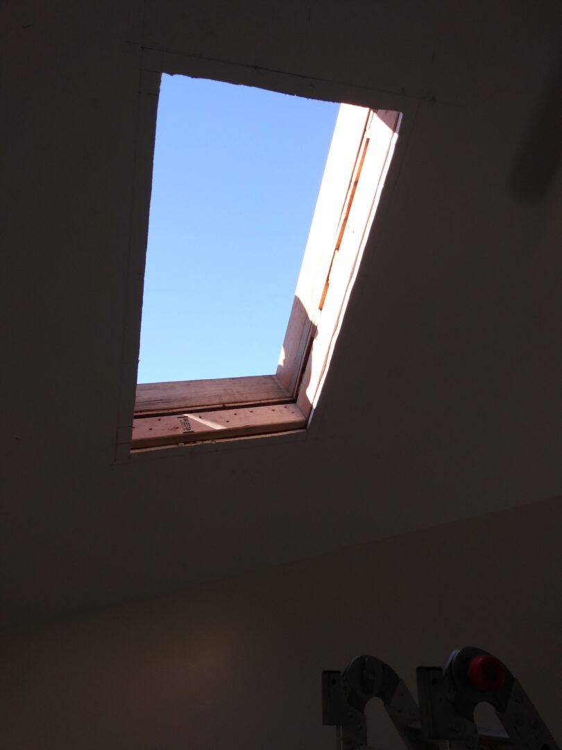 A skylight in the middle of a room.