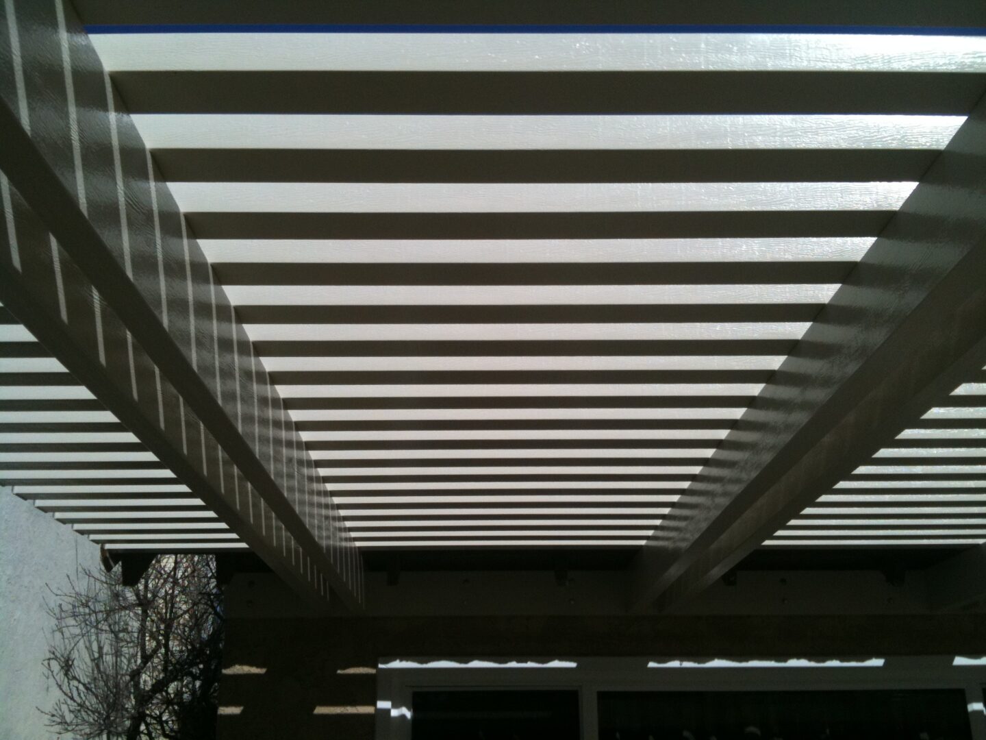 A close up of the ceiling of an outdoor area.