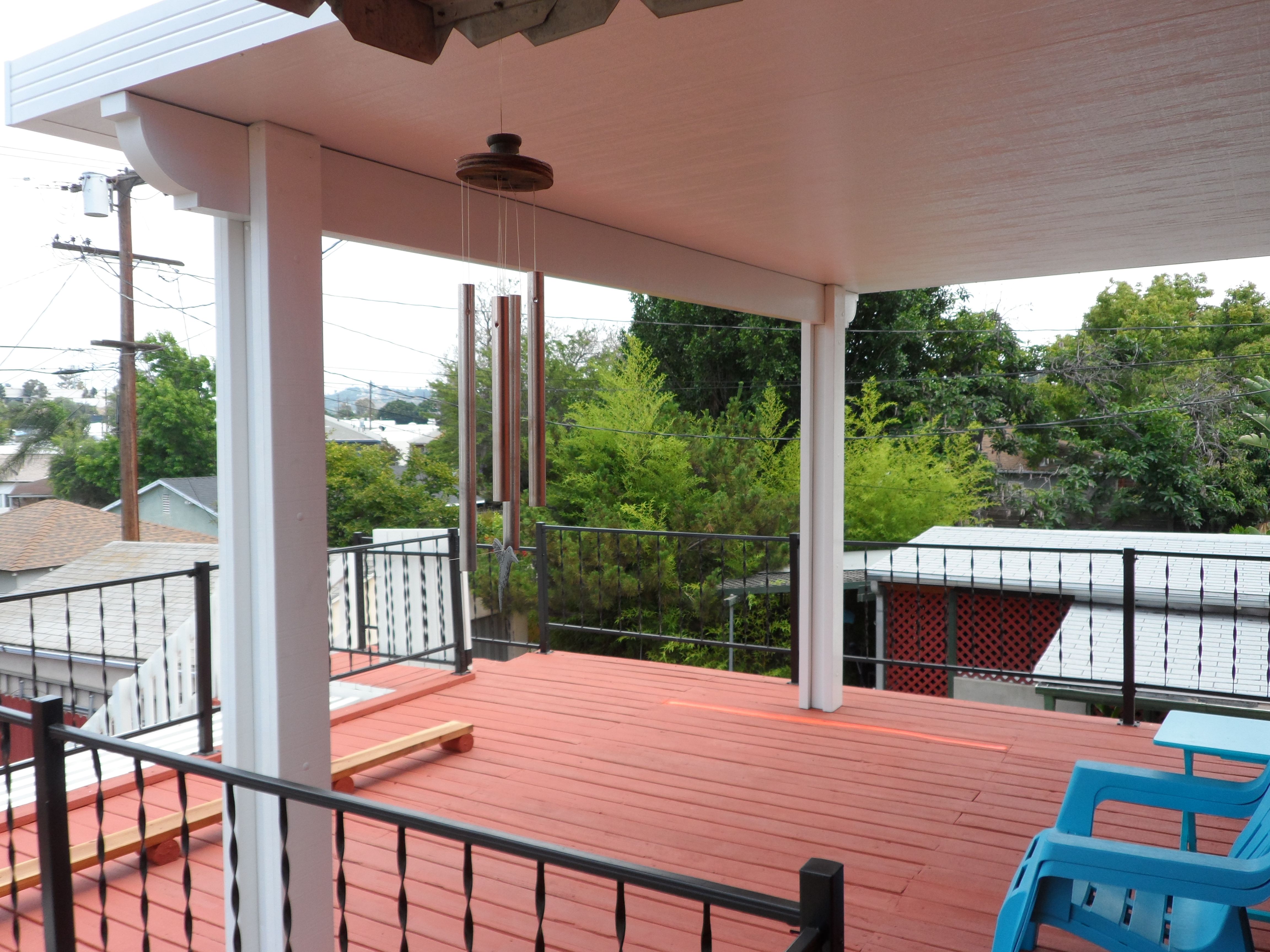 A deck with a view of the backyard.