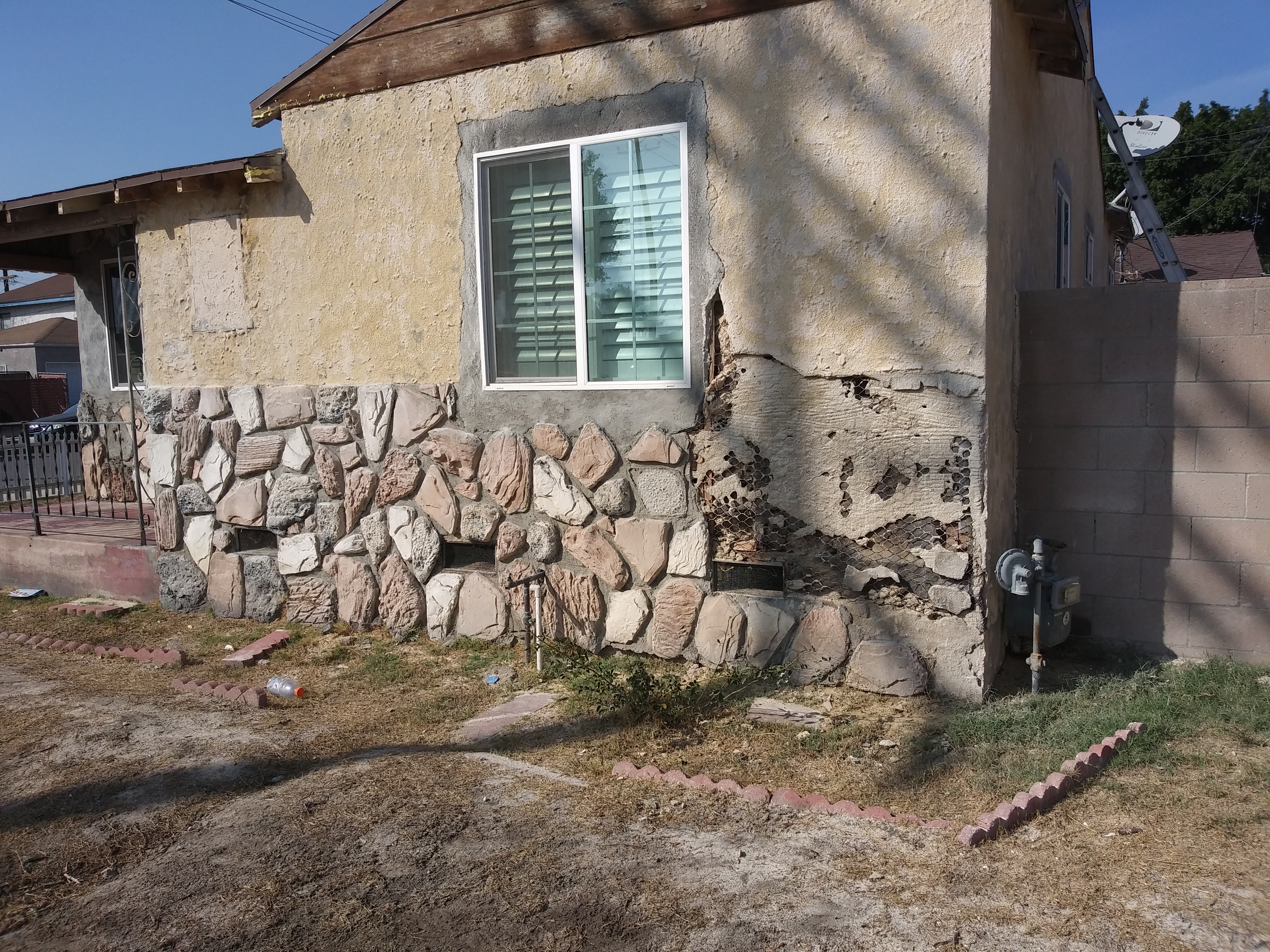 A house with rocks on the side of it