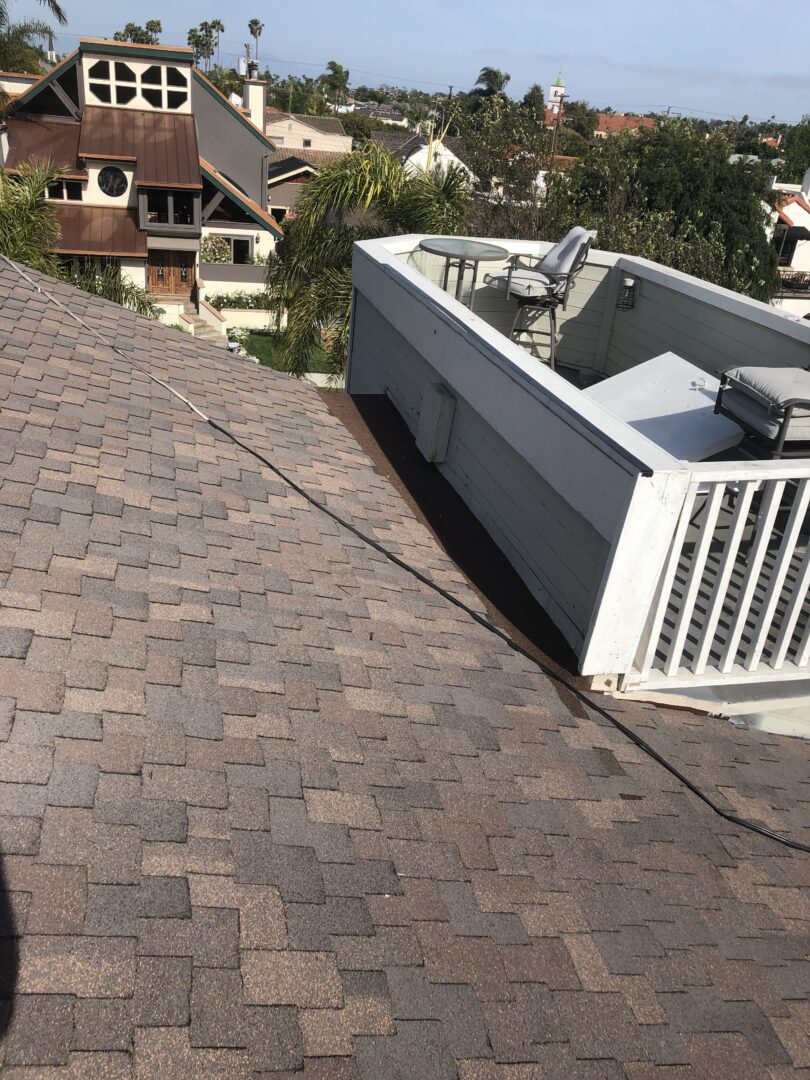 A roof with a balcony and air conditioner on it