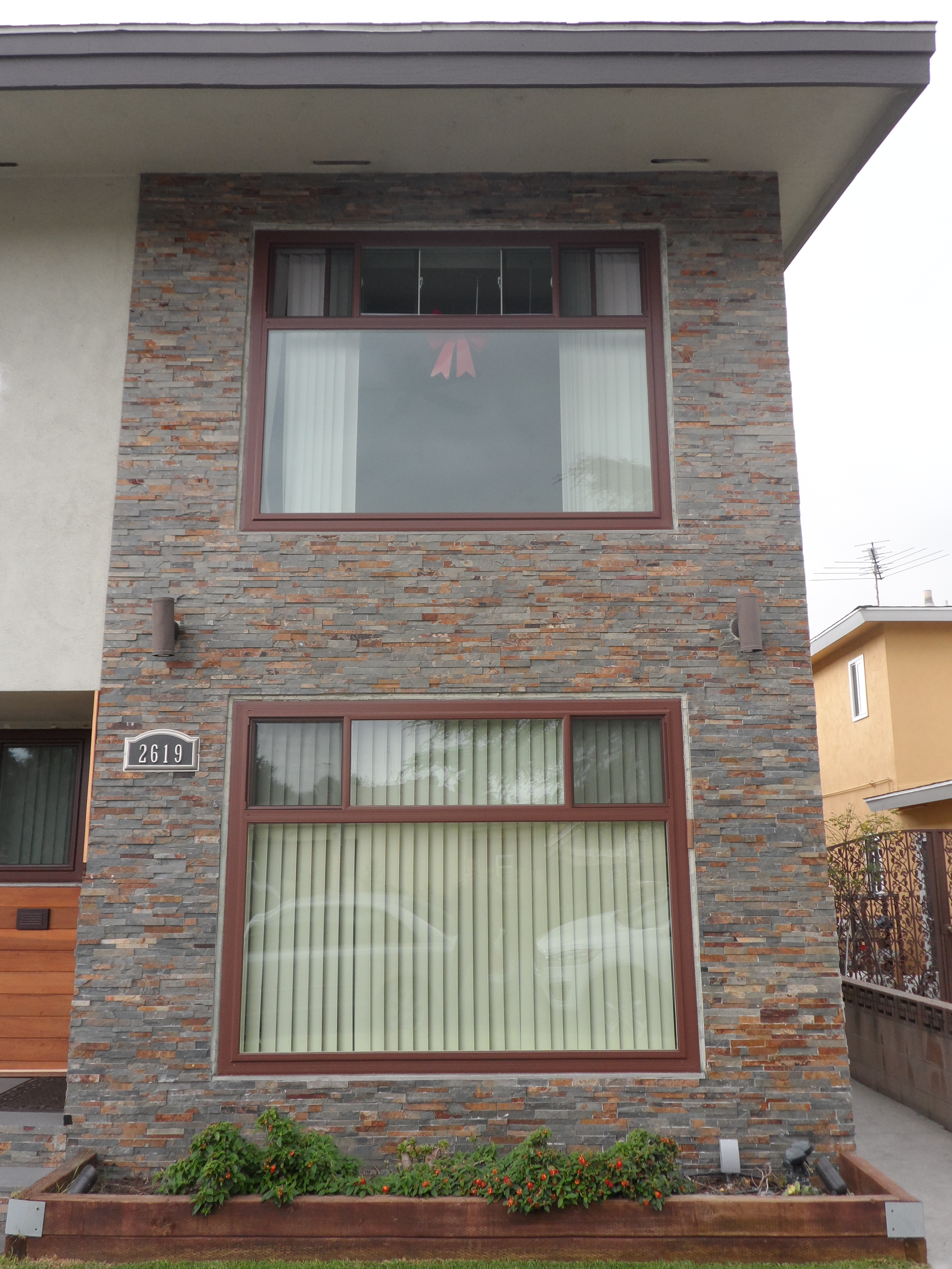 A building with two windows and a door.