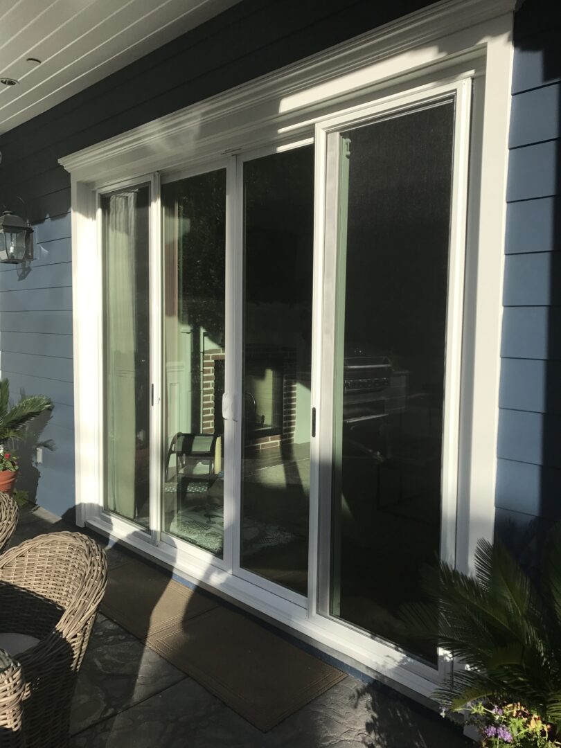 A patio door with the glass open and closed.