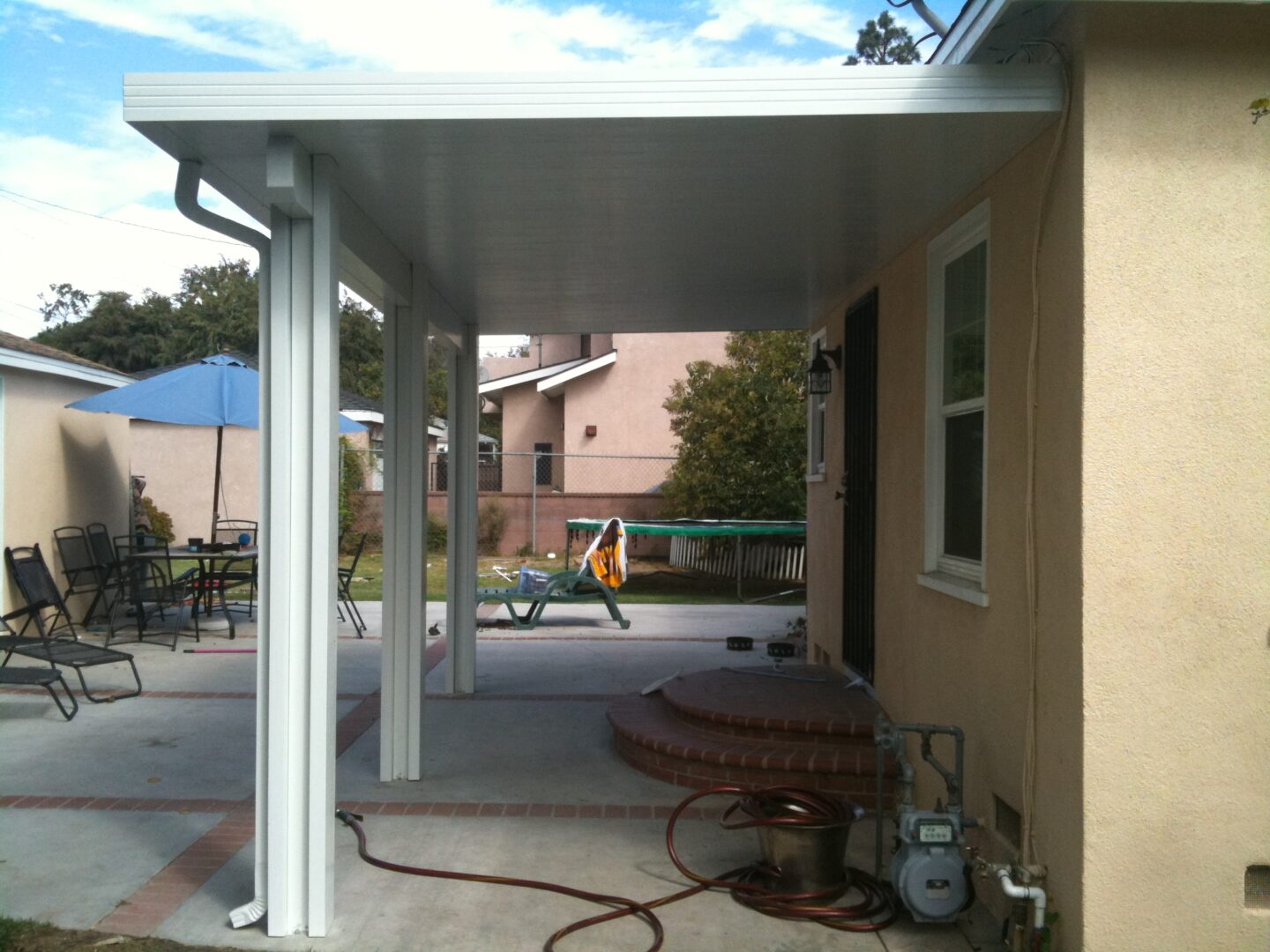 A patio cover with a fire hydrant in the middle of it.