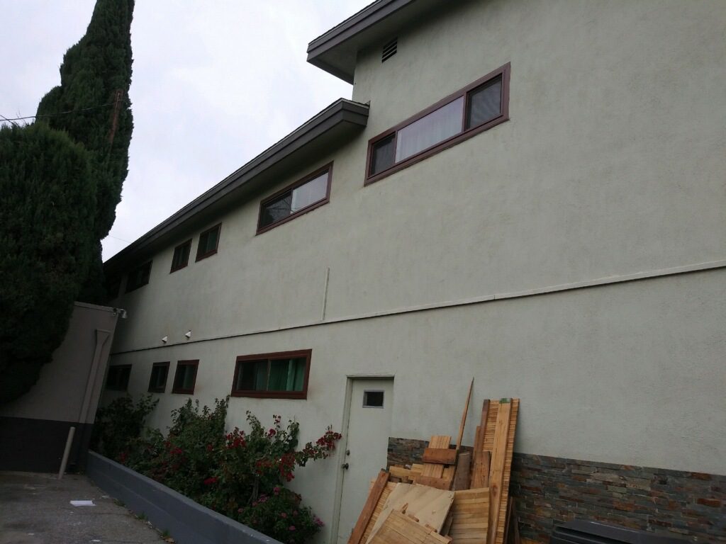 A building with some wood on the side of it