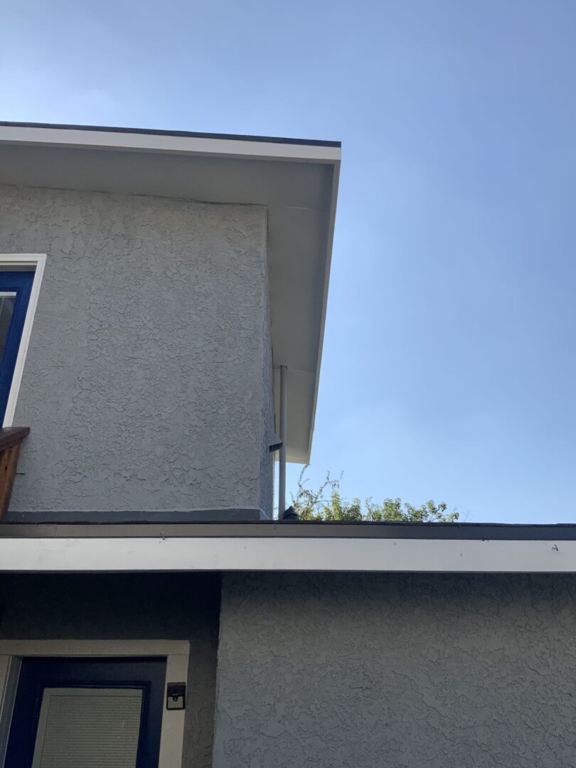 A house with a blue door and white trim.