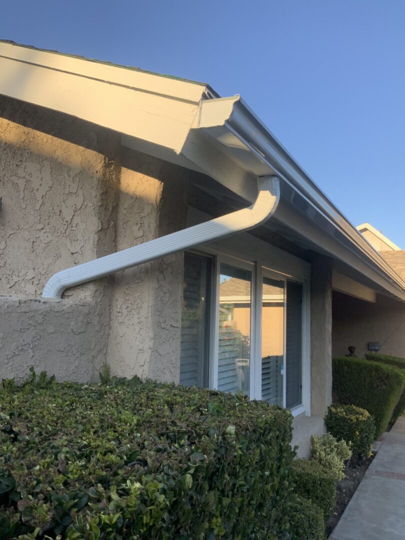 A house with a gutter on the roof