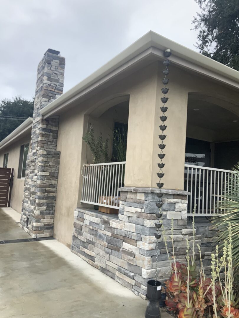 A house with a fence and a balcony