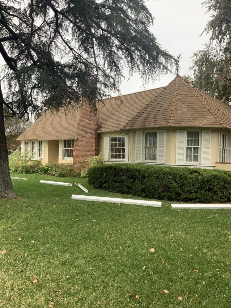 A house with a tree in front of it