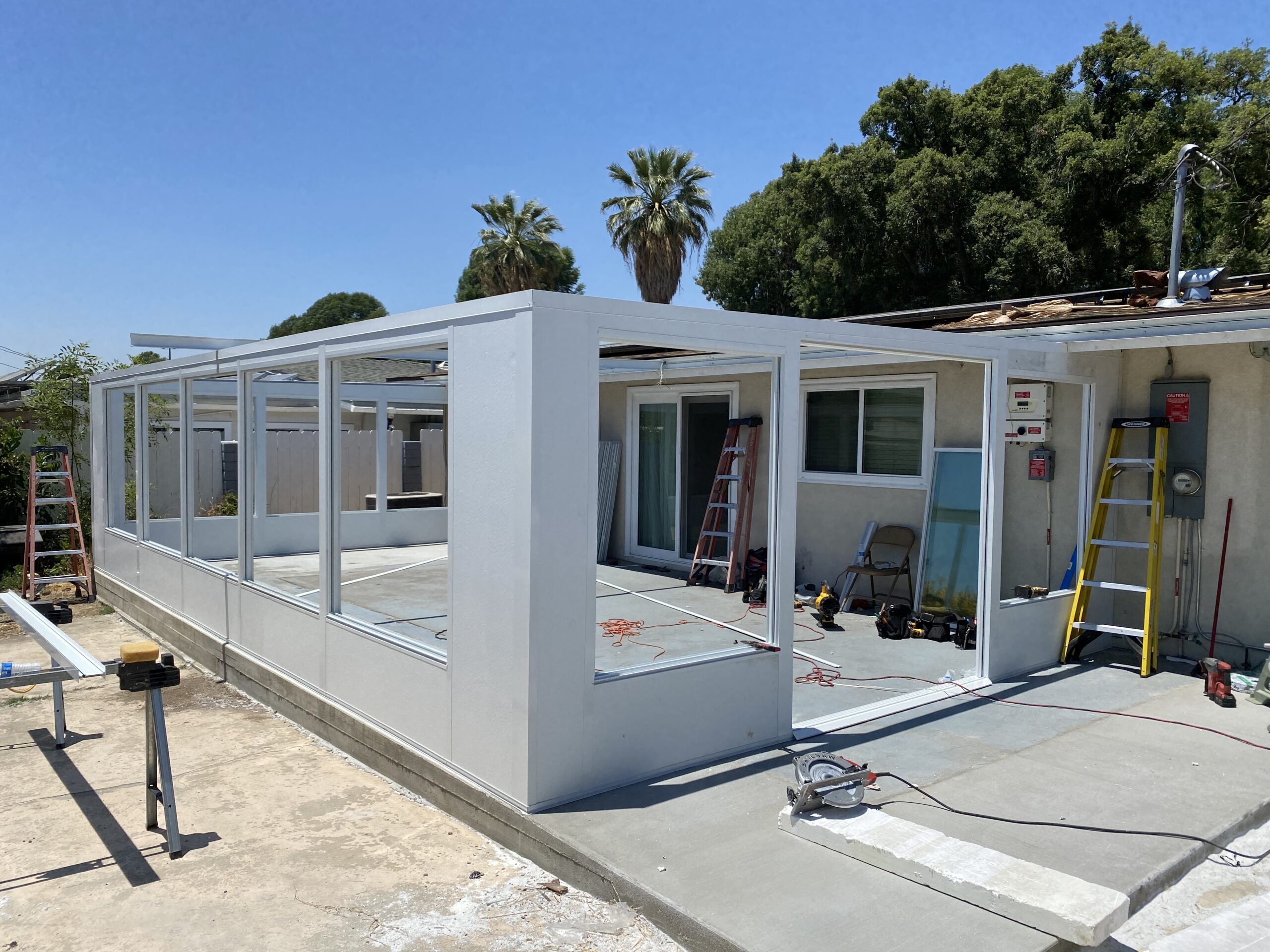 A building being built with white walls and doors.