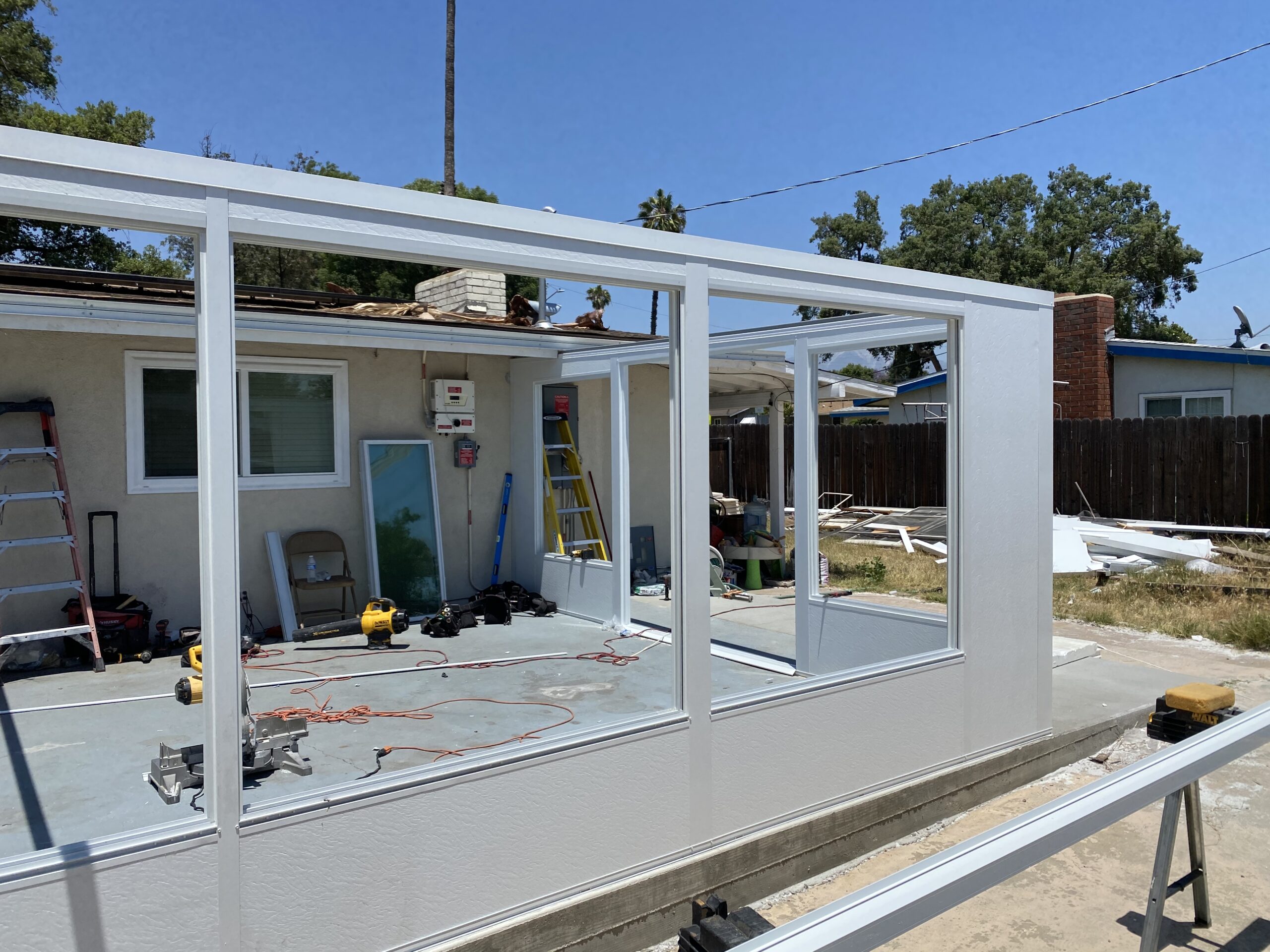 A building being built with windows and doors.