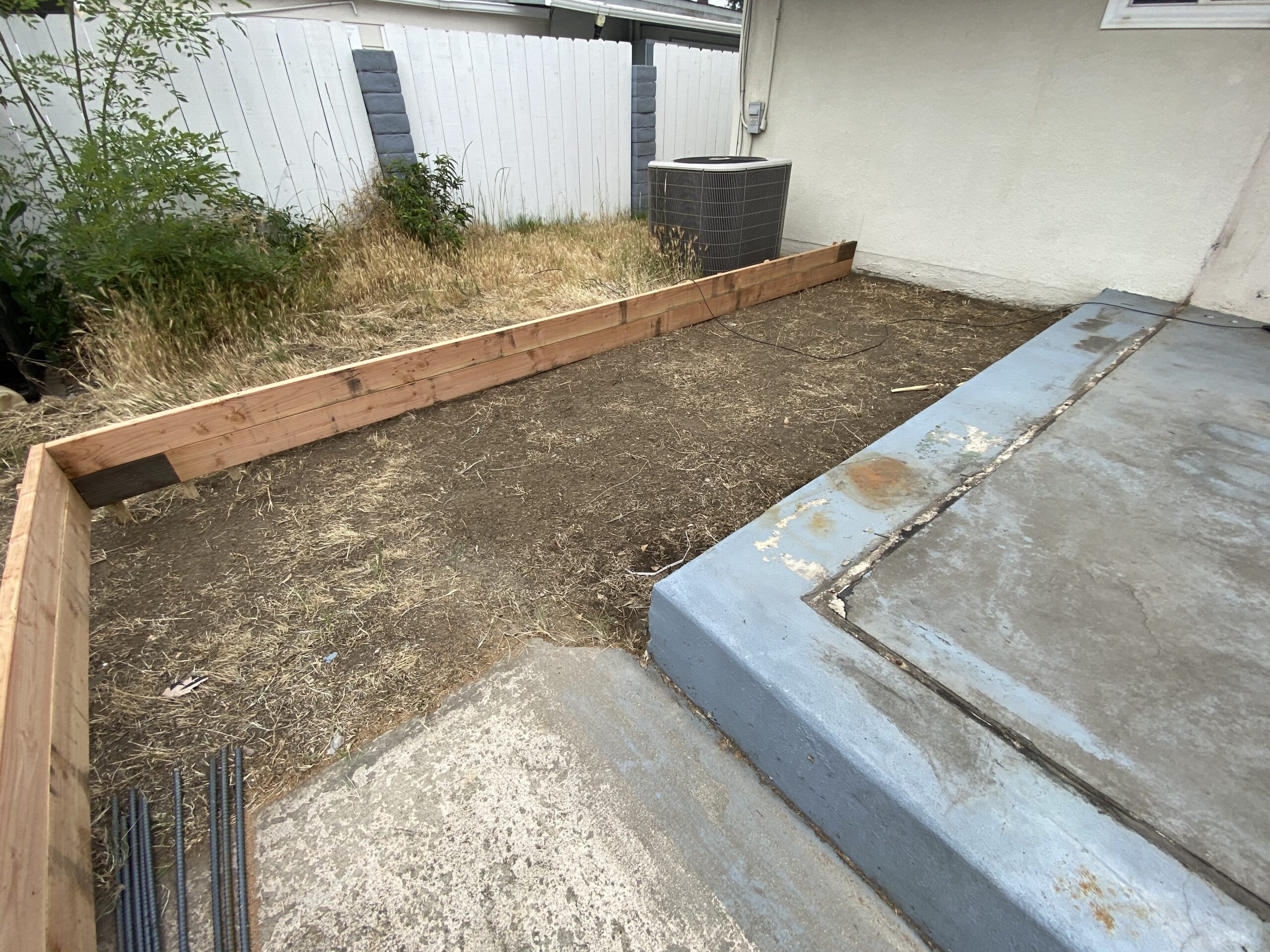 A concrete slab with some wood on it